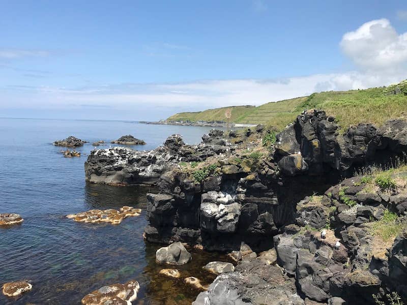 Face on Rocks - Image 1