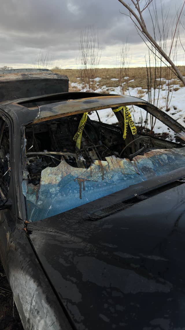 Burnt Car Wreckage in Madison Field - Image 1