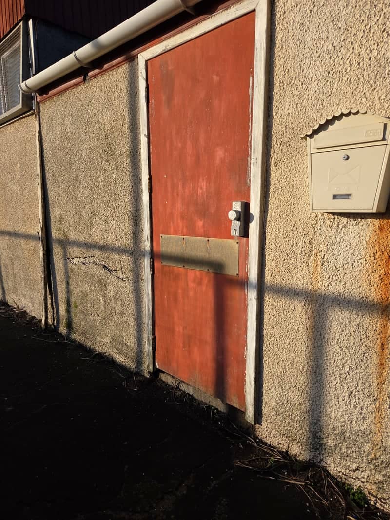 Weathered Red Door & Shadow Play - Image 1