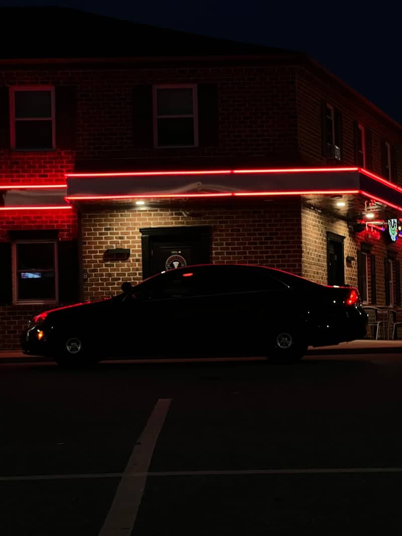 Red Neon Brick Facade - Image 1