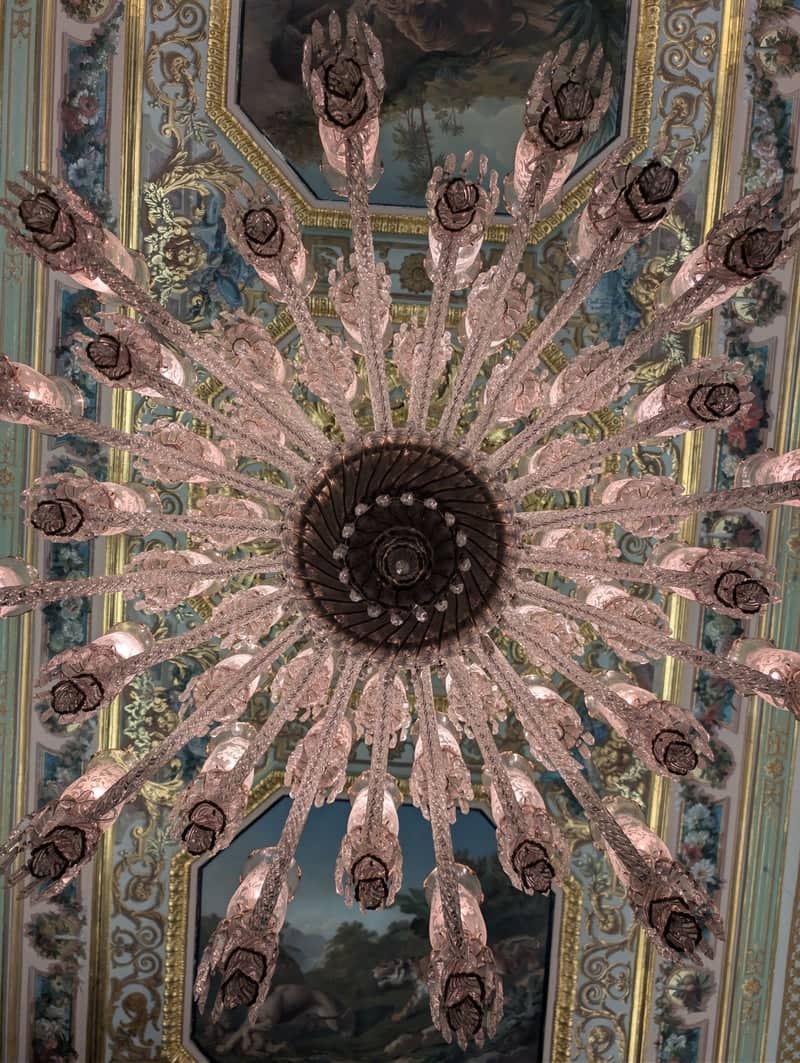 Ornate Chandelier and Frescoed Ceiling - Image 1