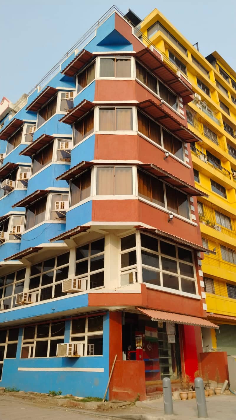 Colorful Corner Building, Daman - Image 1