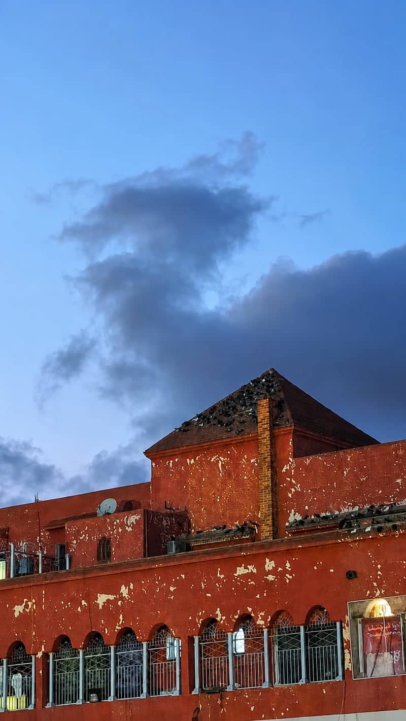 Traditional Red Architecture in Madagh - Image 1